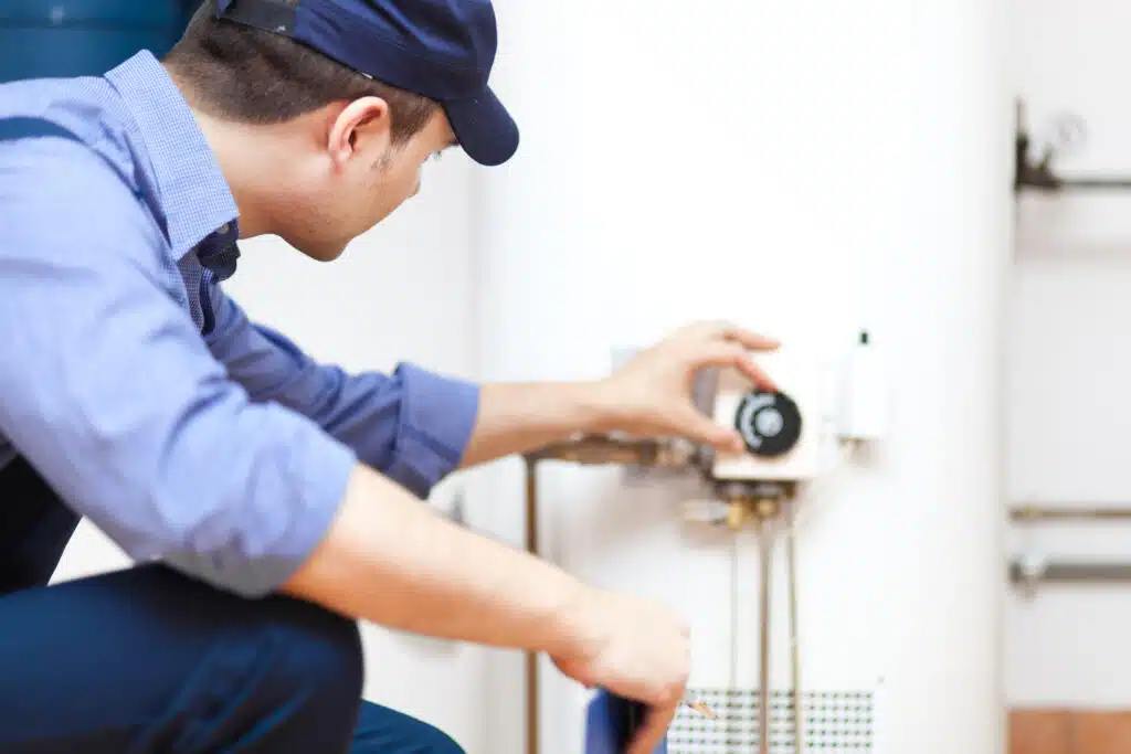 Boiler Performance, Technician repairing an hot-water heater.