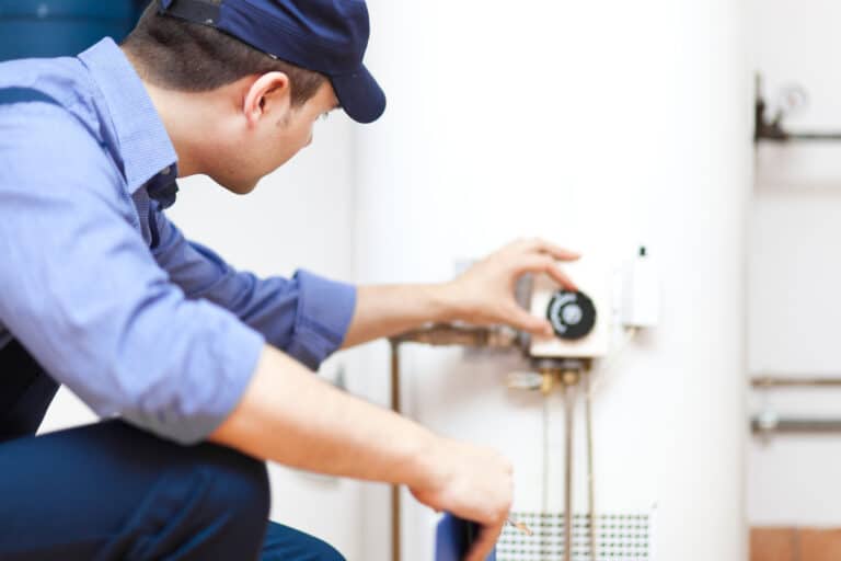 Boiler Performance, Technician repairing an hot-water heater.