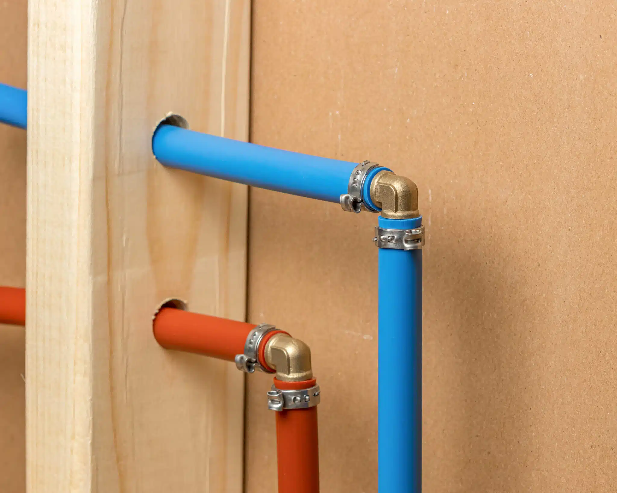 PEX plastic water supply plumbing pipe in wall of house, Home Plumbing Configuration.
