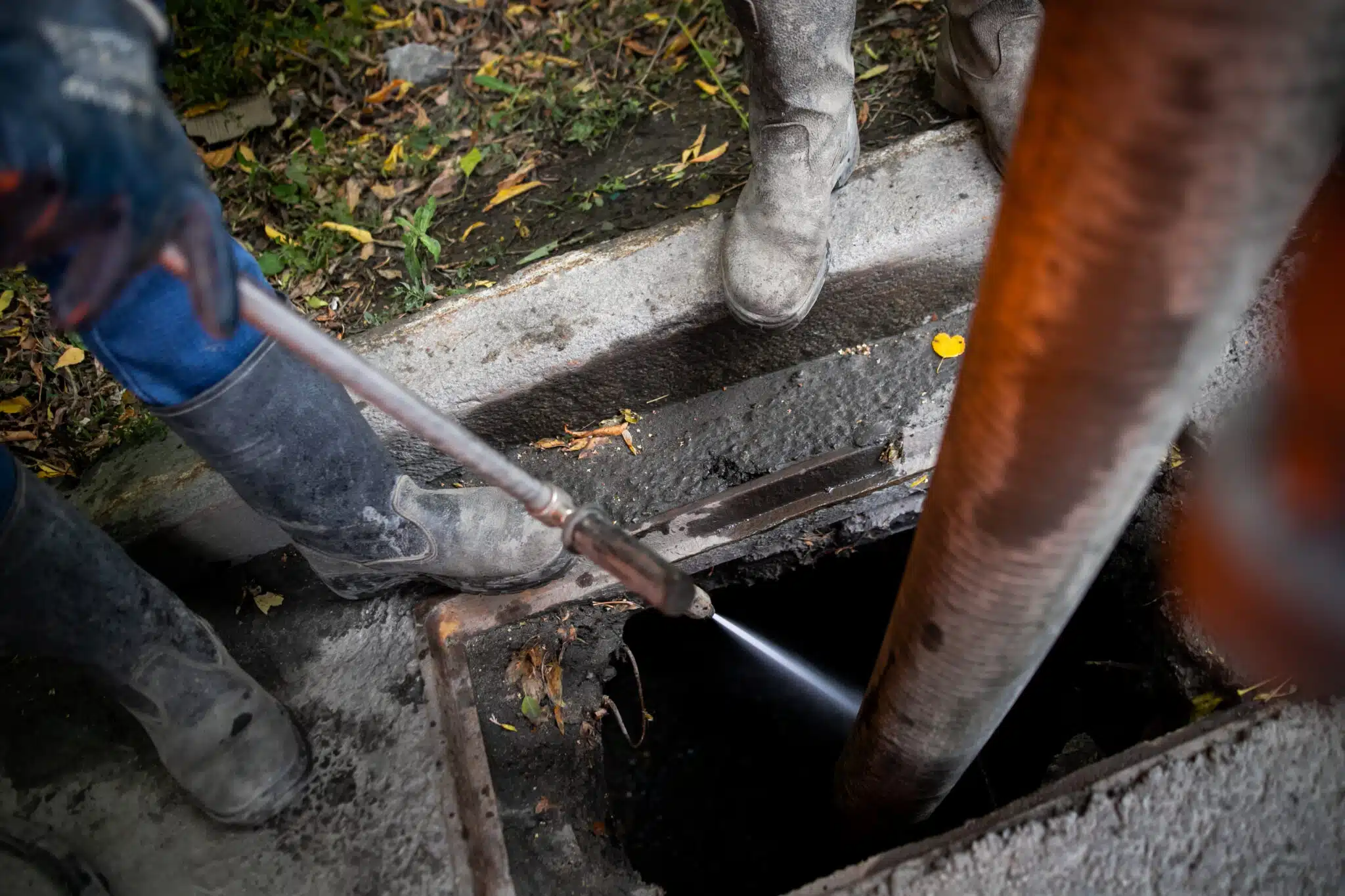 Cleaning drains from debris, clogged drainage systems are cleaned with a pump and water, Prevent Plumbing Blockages.