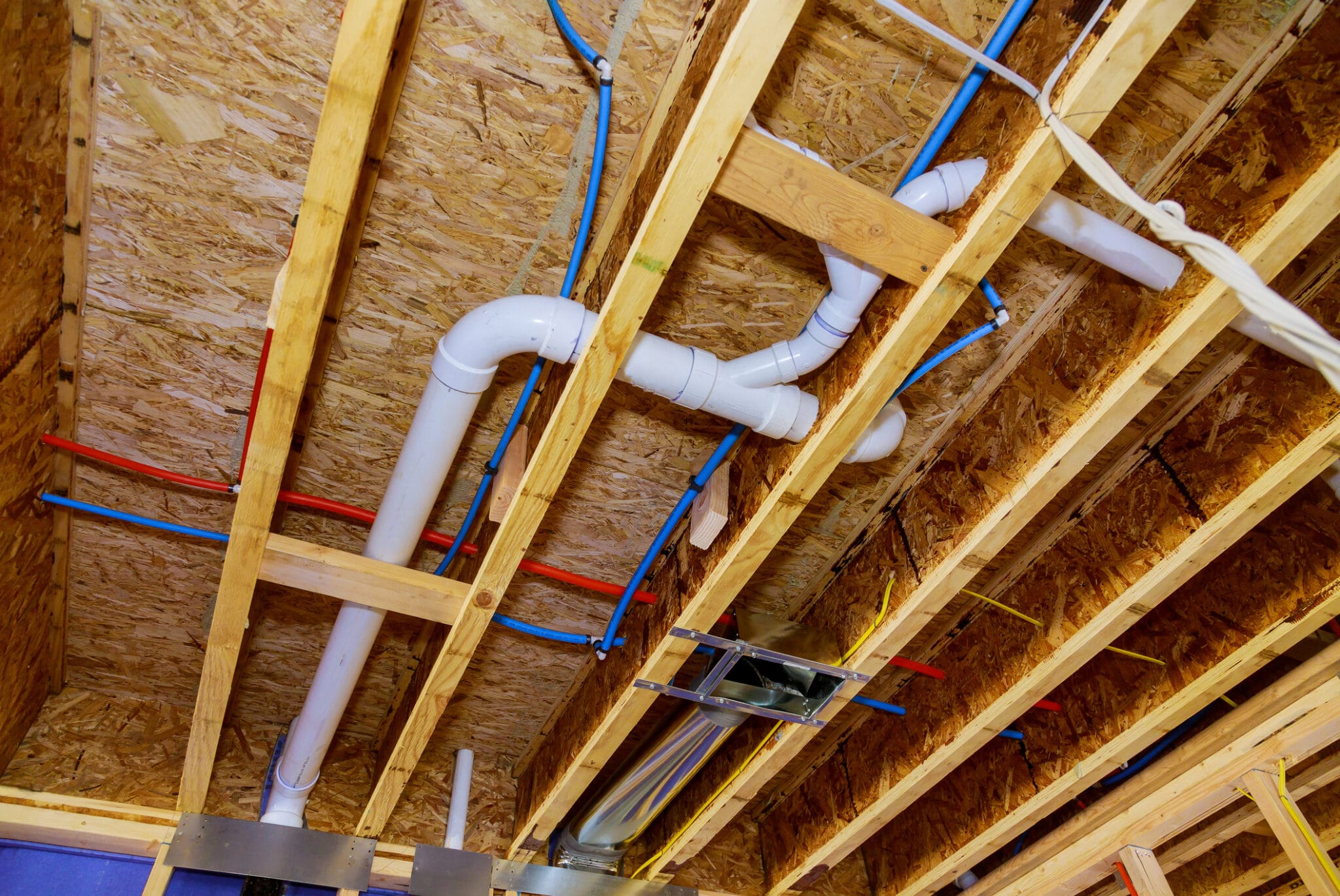 PEX pipe layout in pipes and exposed beams, Seamless Plumbing Systems.